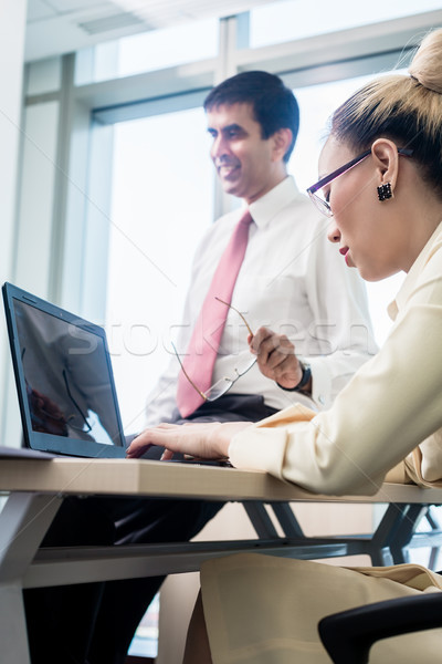 Senior professional giving advise to his junior subordinate  Stock photo © Kzenon