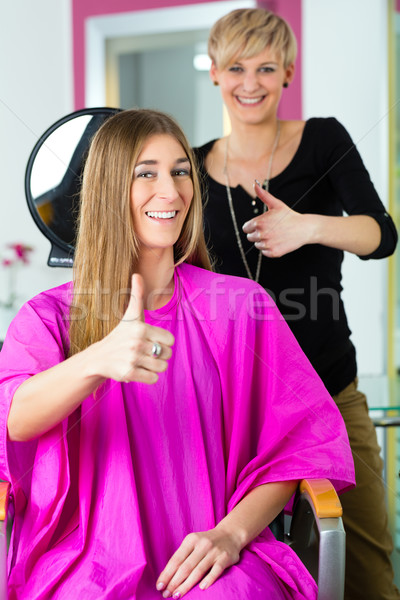 Woman at the hairdresser getting advise Stock photo © Kzenon