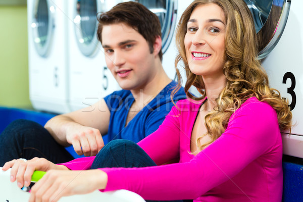 couple in a coin laundry washing Stock photo © Kzenon