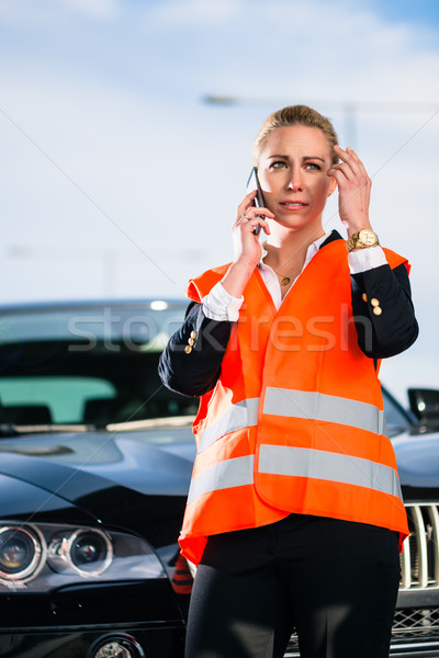 Woman with car breakdown calling towing company Stock photo © Kzenon