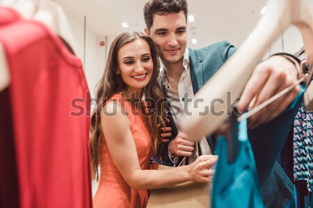 Couple craving for new clothes in fashion shopping spree Stock photo © Kzenon