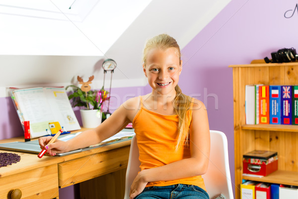 Family - child doing homework Stock photo © Kzenon