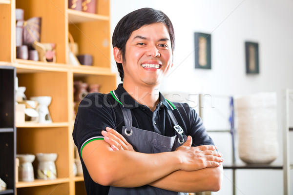 Asian Potter in his shop selling souveniers Stock photo © Kzenon