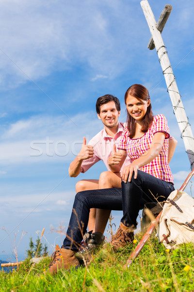 Alps - Hiking Couple takes break in mountains Stock photo © Kzenon