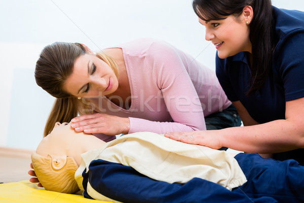 Group of women in first aid class exercising reanimation  Stock photo © Kzenon