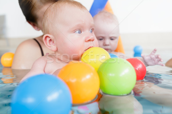 Mums and babies having fun at infant swimming course  Stock photo © Kzenon