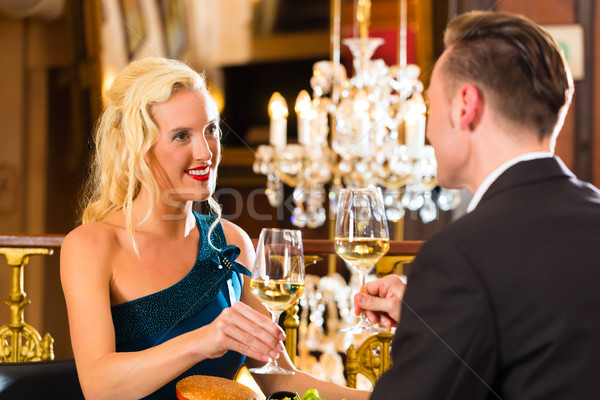 Stock photo: happy couple have a romantic date in restaurant