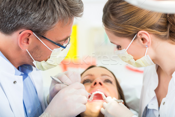 Paciente dentista dental tratamento feminino assistente Foto stock © Kzenon