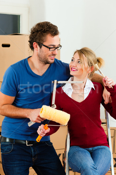 Young couple moving in new home Stock photo © Kzenon