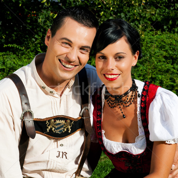 Couple in traditional Bavarian dress in summer Stock photo © Kzenon