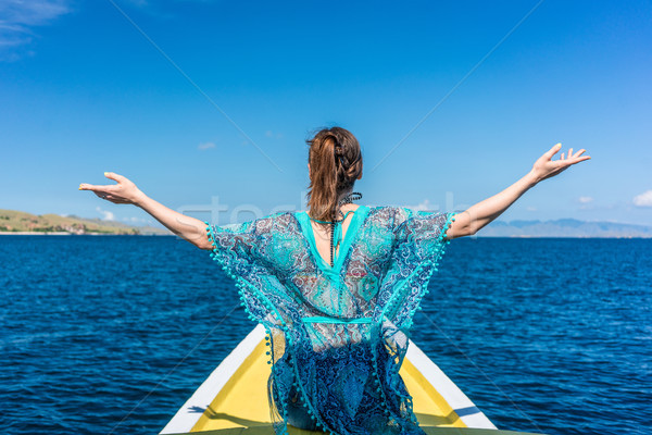 Rear view of a young woman enjoying summer vacation in Flores Is Stock photo © Kzenon