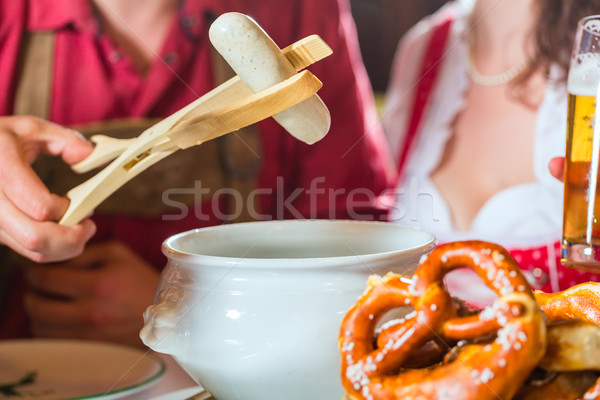 People in Bavarian Tracht eating in restaurant or pub Stock photo © Kzenon