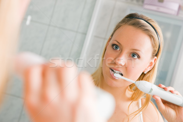 Fogmosás fiatal nő nő fürdőszoba tükör női Stock fotó © Kzenon