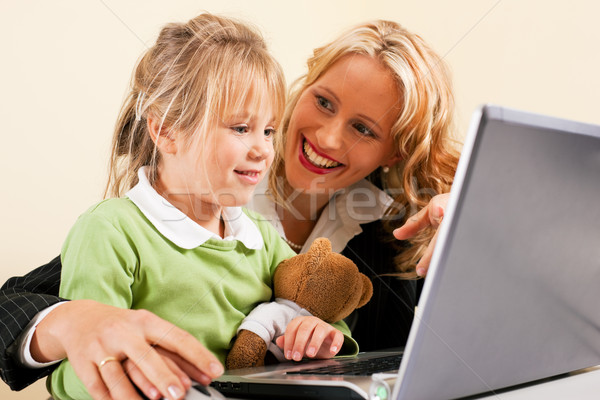 Businesswoman and mother showing kid the internet Stock photo © Kzenon