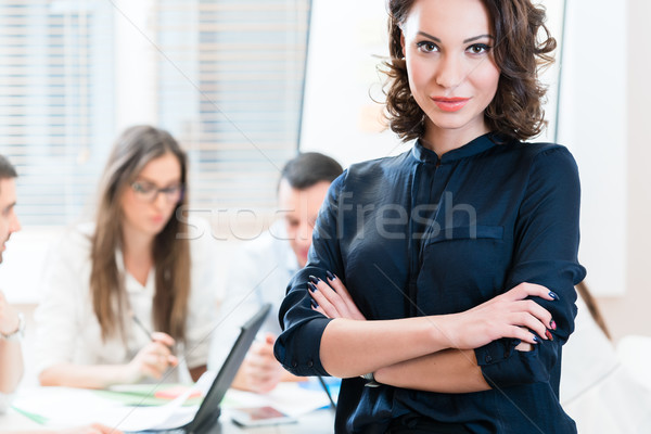 Manager with her team working in the office Stock photo © Kzenon