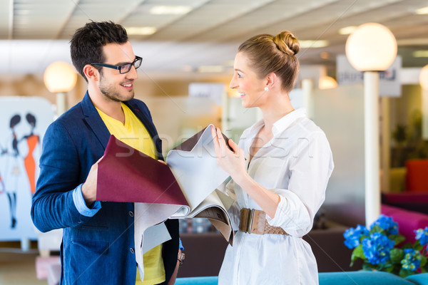 Couple picking couch seat cover in furniture store Stock photo © Kzenon