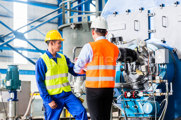 Worker and manager in industrial factory  Stock photo © Kzenon