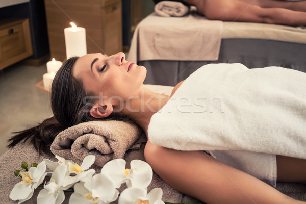 Man and woman lying down on massage beds at Asian wellness cente Stock photo © Kzenon
