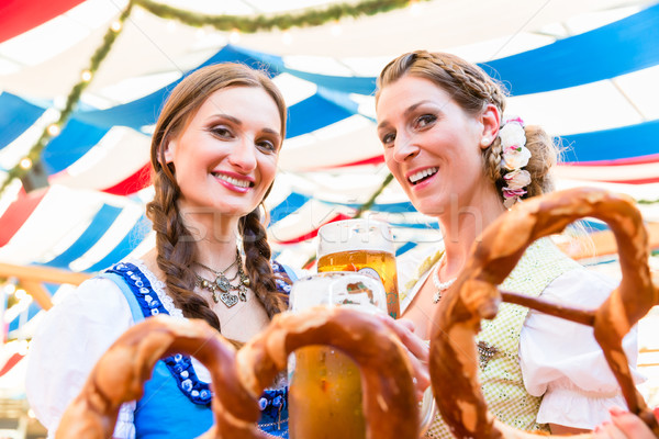 Friends at Bavarian Fair with giant pretzels Stock photo © Kzenon
