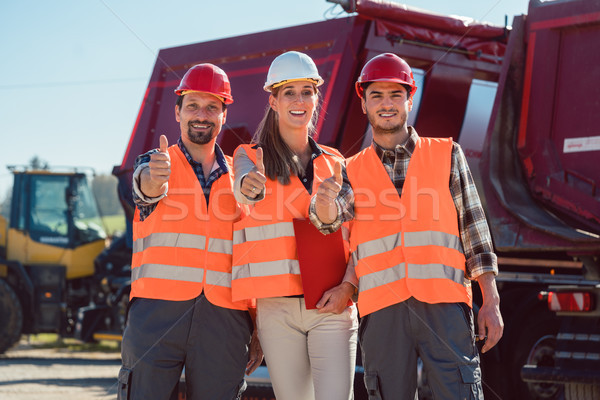 Colleagues in a freight forwarding company giving thumbs up Stock photo © Kzenon