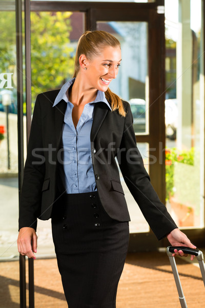 Businesswoman arriving at Hotel Stock photo © Kzenon