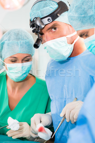 Stock photo: Surgeons operating in operation theater room