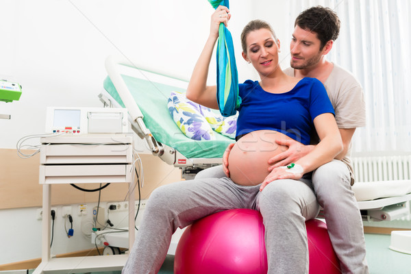 Pregnant woman and man in delivery room of hospital Stock photo © Kzenon