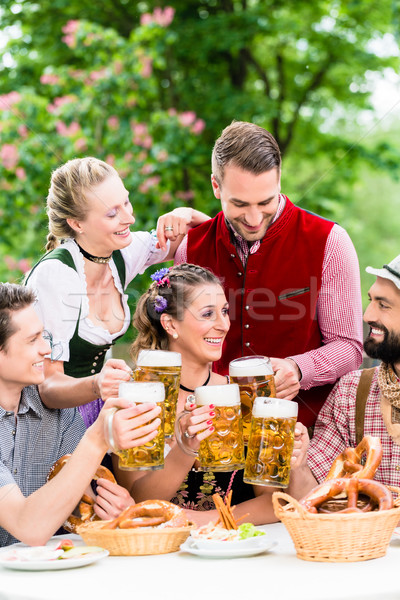 In Beer garden - friends drinking beer in Bavaria Stock photo © Kzenon