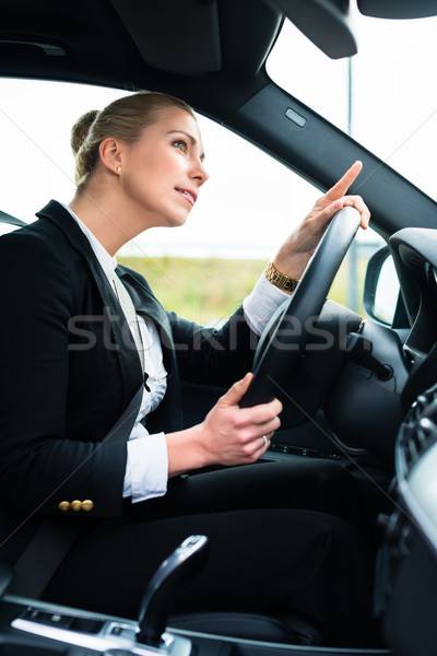 Woman in car being angry cursing other driver Stock photo © Kzenon