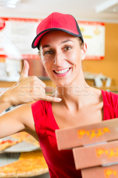 Delivery service - woman holding pizza boxes Stock photo © Kzenon