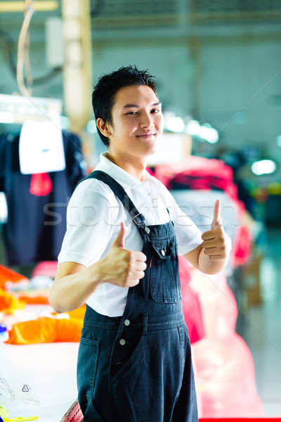 Worker in a chinese garment factory Stock photo © Kzenon