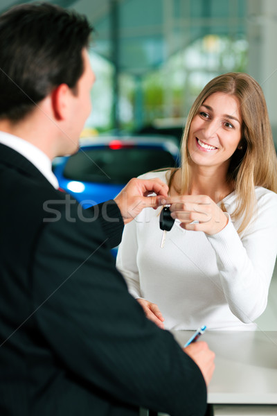 Woman buying car - key being given Stock photo © Kzenon