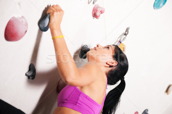 Woman at the climbing wall  Stock photo © Kzenon