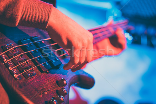 Guitar player in front of amplifier Stock photo © Kzenon