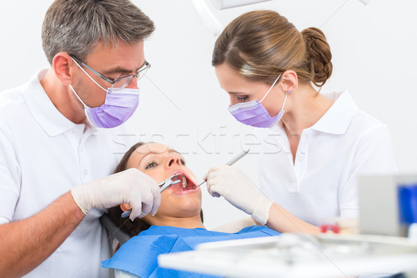 Patient with Dentist - dental treatment Stock photo © Kzenon