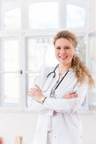 Portrait of young female doctor in clinic Stock photo © Kzenon