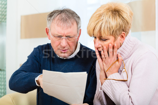 Seniors at home receiving a bad message Stock photo © Kzenon