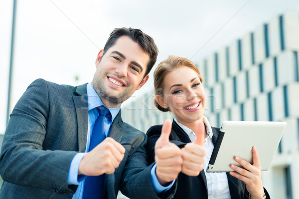 Businesspeople working outdoor with success Stock photo © Kzenon