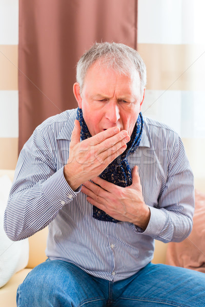 Stock photo: Senior coughing and having the flu