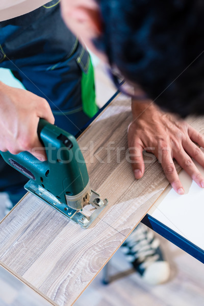 Csináld magad munkás vág fából készült panel fűrész Stock fotó © Kzenon