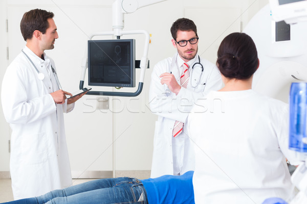Doctors in hospital at CT scan with patient Stock photo © Kzenon