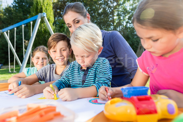 Mum painting pictures with their children and during lunch break Stock photo © Kzenon