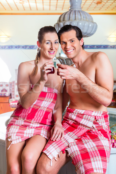 Couple drinking Turkish tea in wellness spa Stock photo © Kzenon