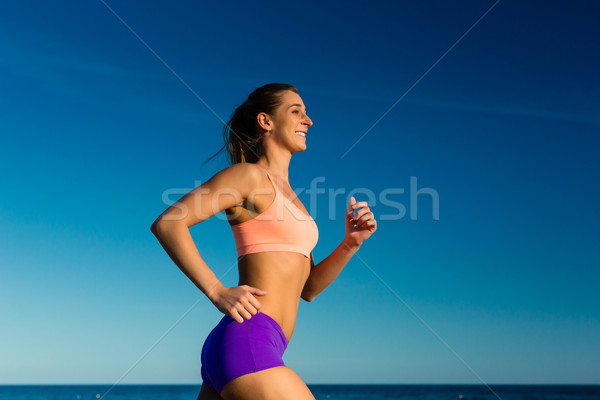 Sport and Fitness - woman jogging Stock photo © Kzenon