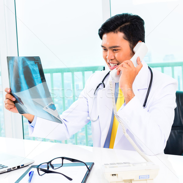 Stock photo: Asian doctor diagnosis radiograph in practise