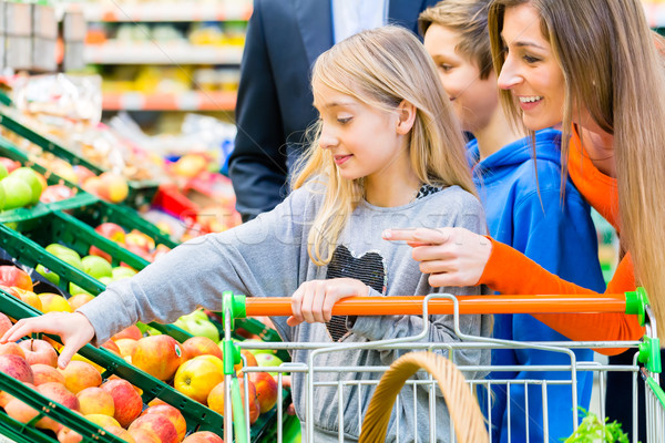 Family grocery shopping in hypermarket Stock photo © Kzenon