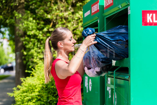 Woman at clothes recycling skip  Stock photo © Kzenon