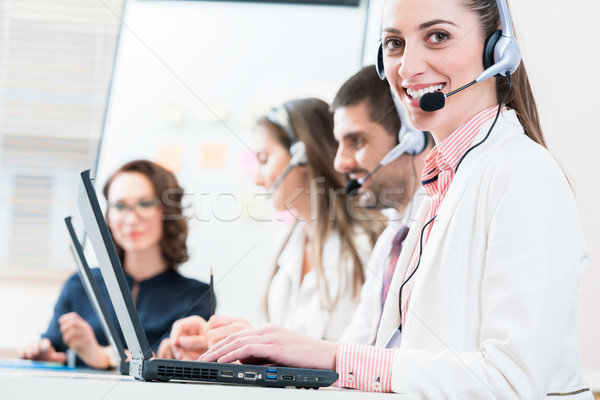 Woman and men working as call center agents Stock photo © Kzenon