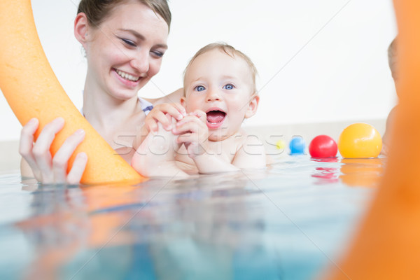 Mothers being happy about their babies playing with each other i Stock photo © Kzenon