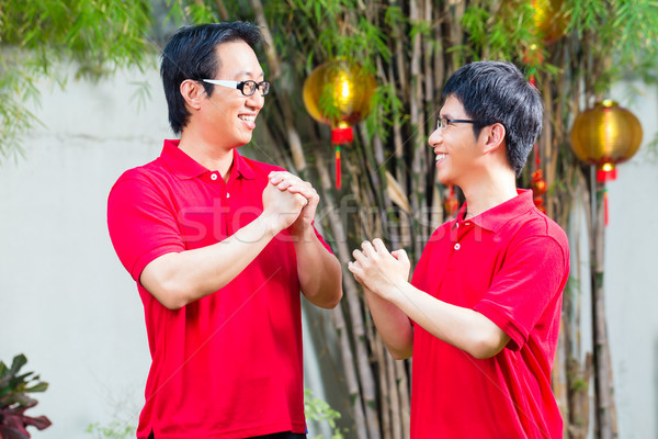Father and son celebrate Chinese new year  Stock photo © Kzenon